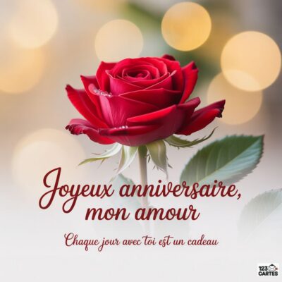 Une rose rouge avec des perles sur ses pétales, accompagnée du message Joyeux anniversaire, mon amour.